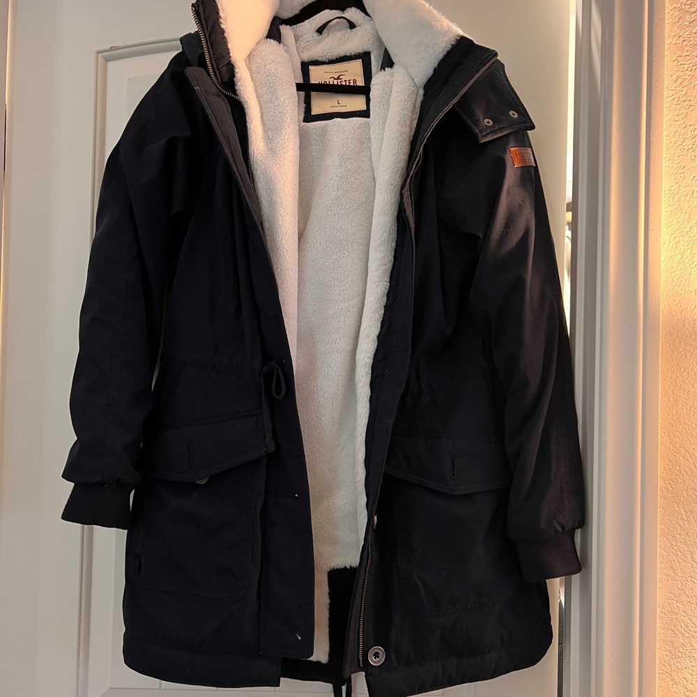 Navy blue Hollister twill jacket with white fleece lining
